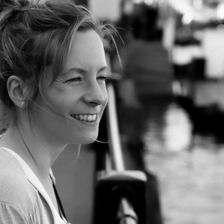 Aanya Rao, Lead Design Curator at HarvestAnchorSubtle, reviewing corporate floral arrangements